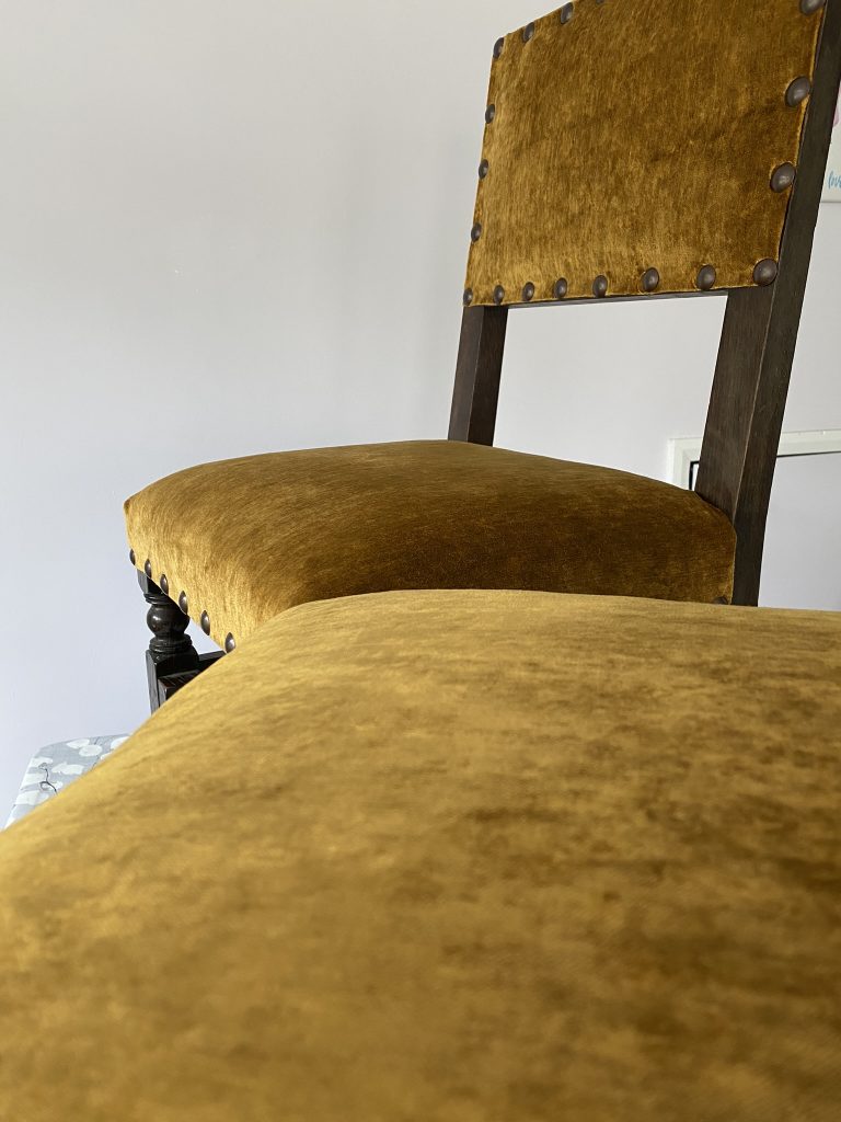 Dining chairs reupholstered by Heyday Upholstery using a mixture of modern and traditional upholstery materials.